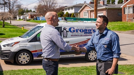Groggs Technician Shaking Hands With Cusomter