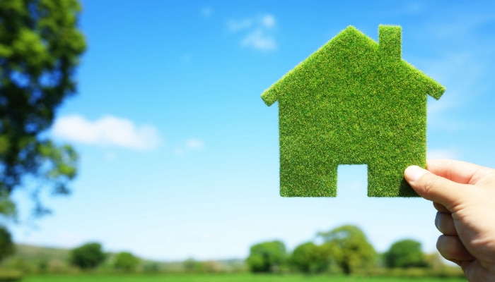 Hand Holding Green Home Hand Holding Green Home
