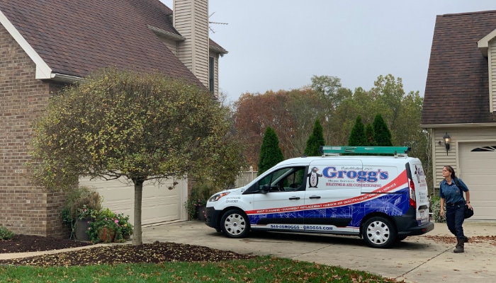 Technician Walking From Van To Residential Home Technician Walking From Van To Residential Home